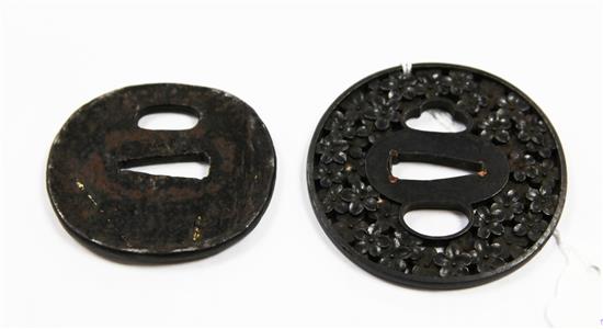 A 19th century Japanese tsuba and another